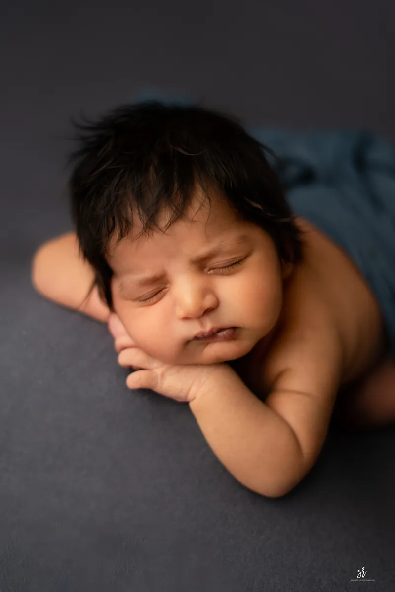 Carefully styled newborn portrait preserving the smallest days · 02