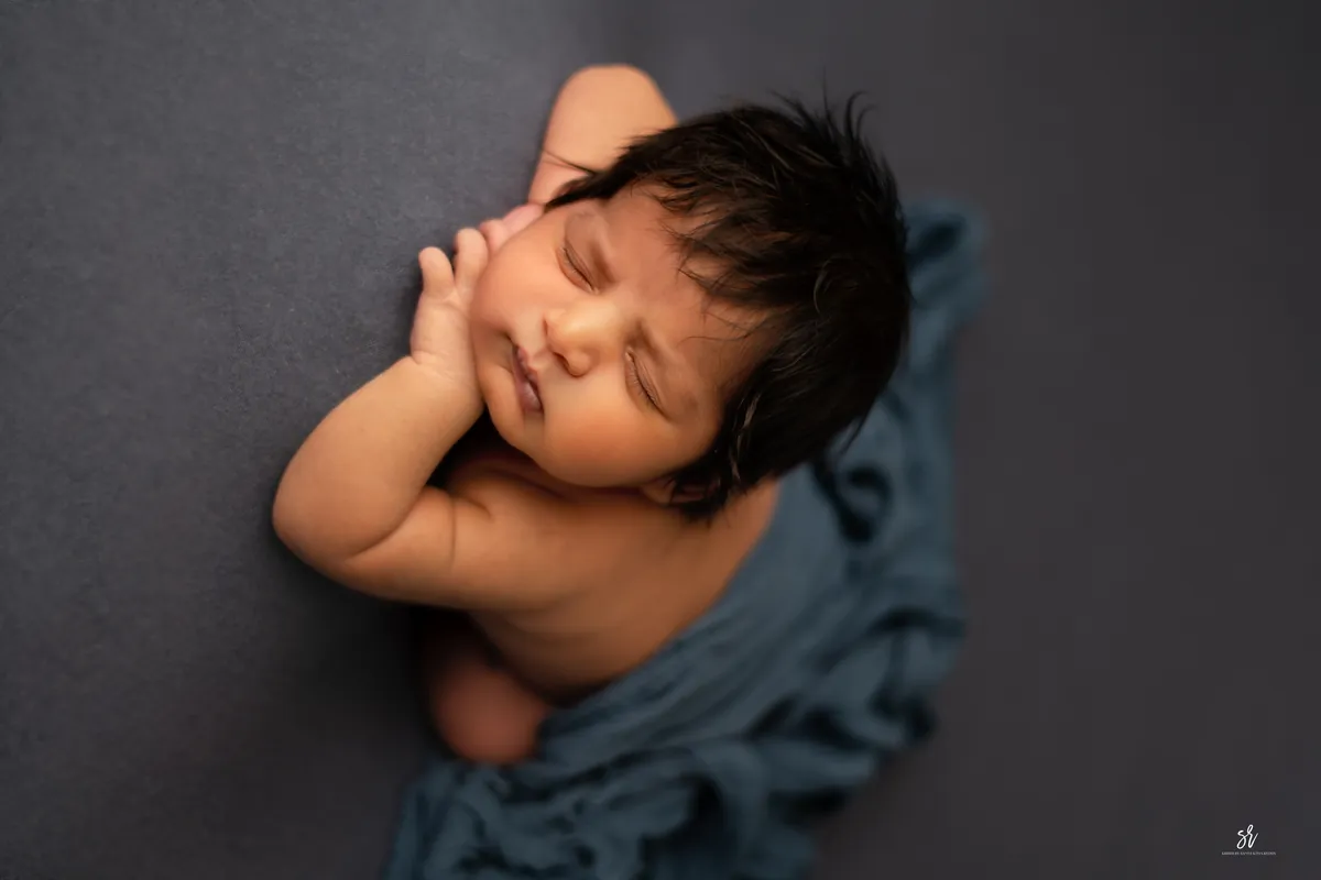 Carefully styled newborn portrait preserving the smallest days · 03