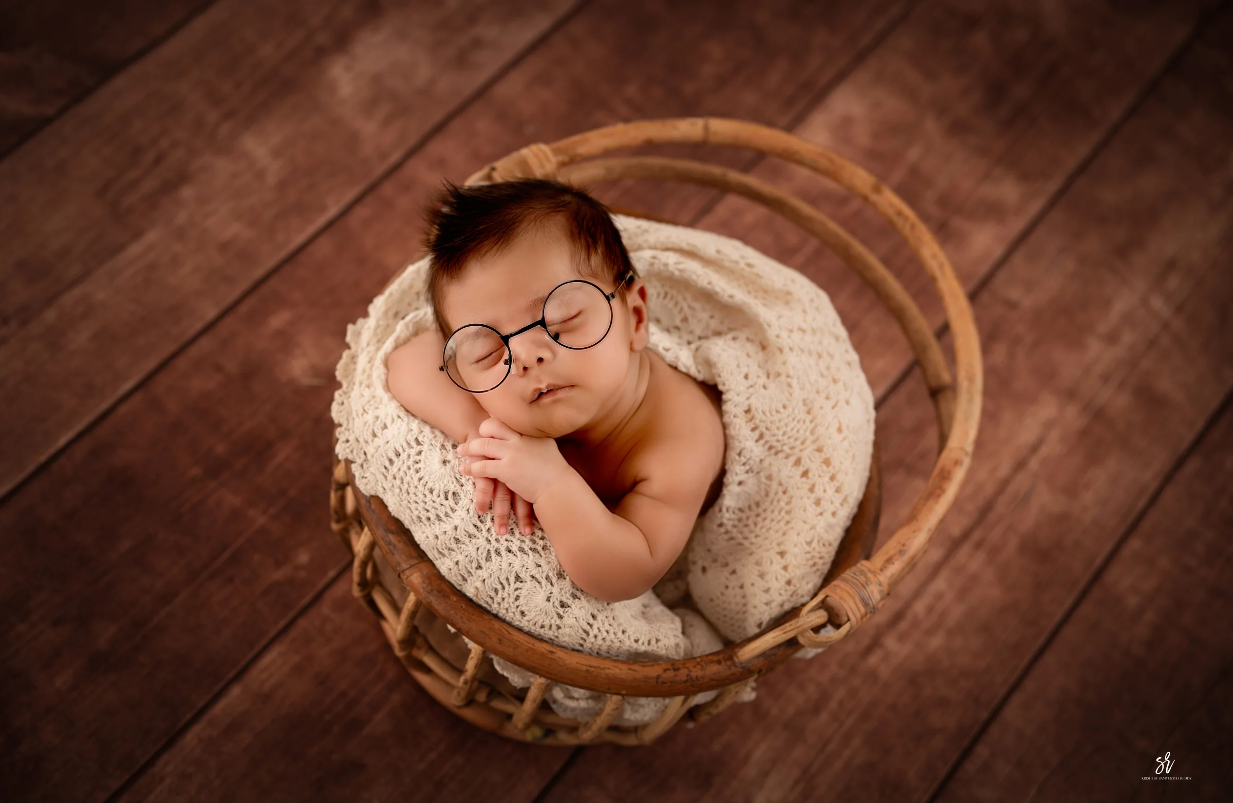 Carefully styled newborn portrait preserving the smallest days · 08