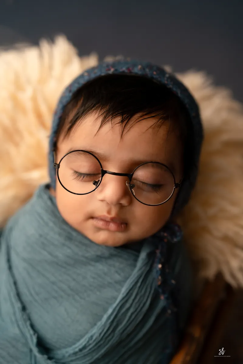 Carefully styled newborn portrait preserving the smallest days · 11