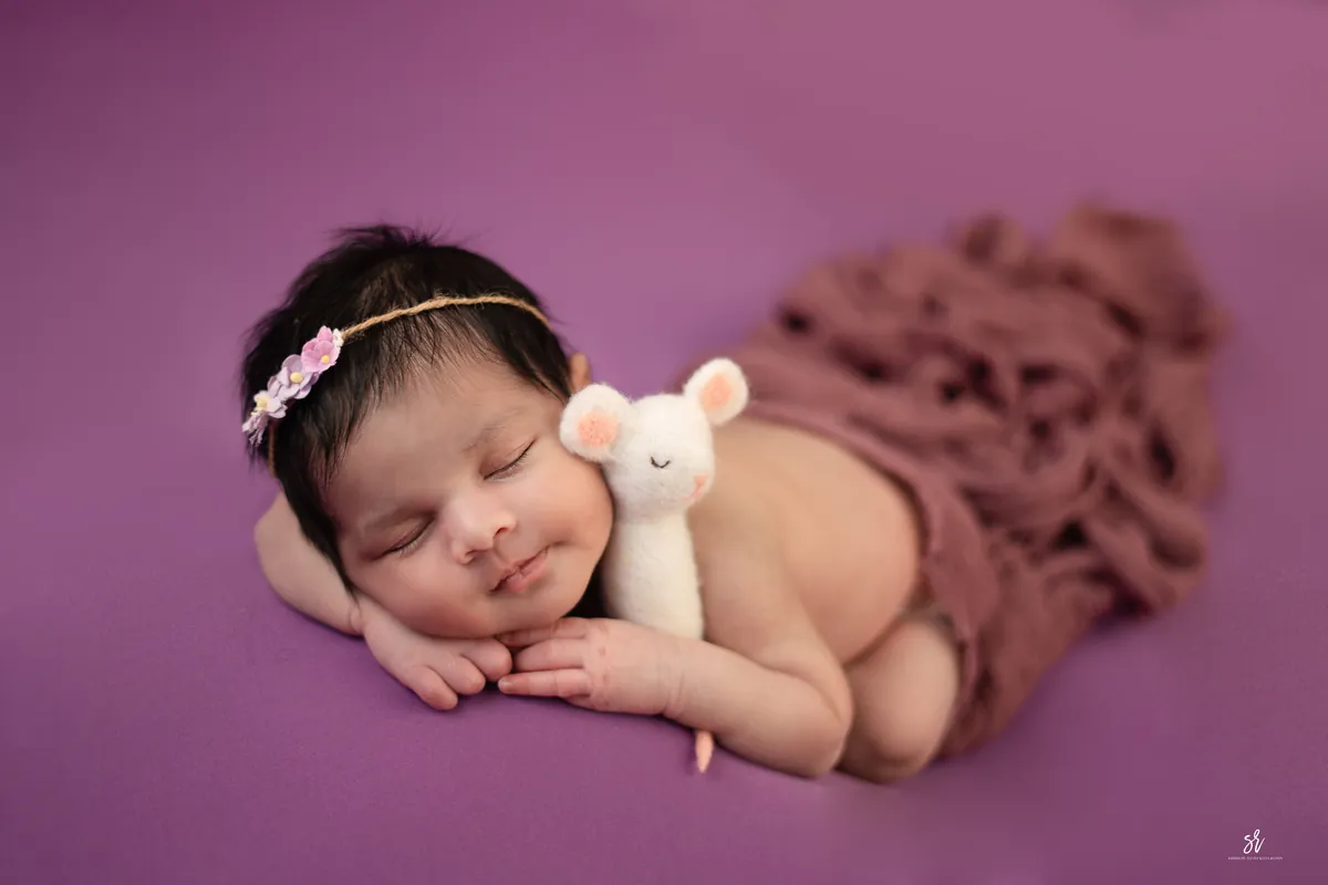 Carefully styled newborn portrait preserving the smallest days · 16