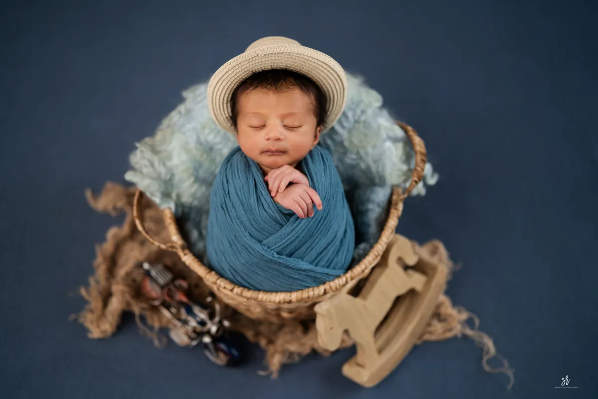 Carefully styled newborn portrait preserving the smallest days · 19