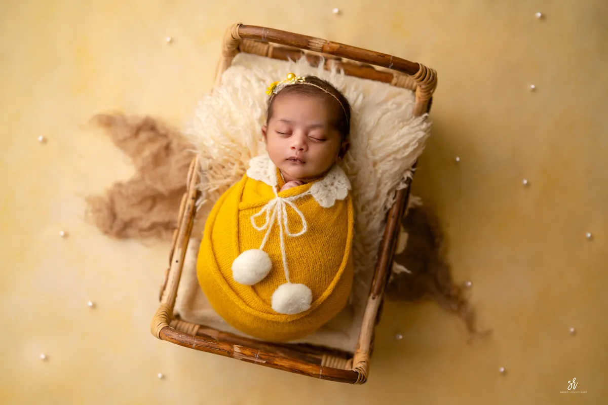 Carefully styled newborn portrait preserving the smallest days · 21