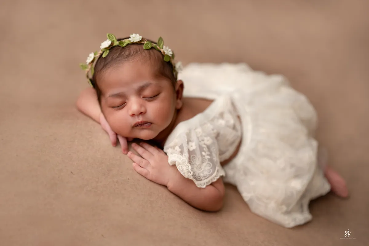 Carefully styled newborn portrait preserving the smallest days · 23