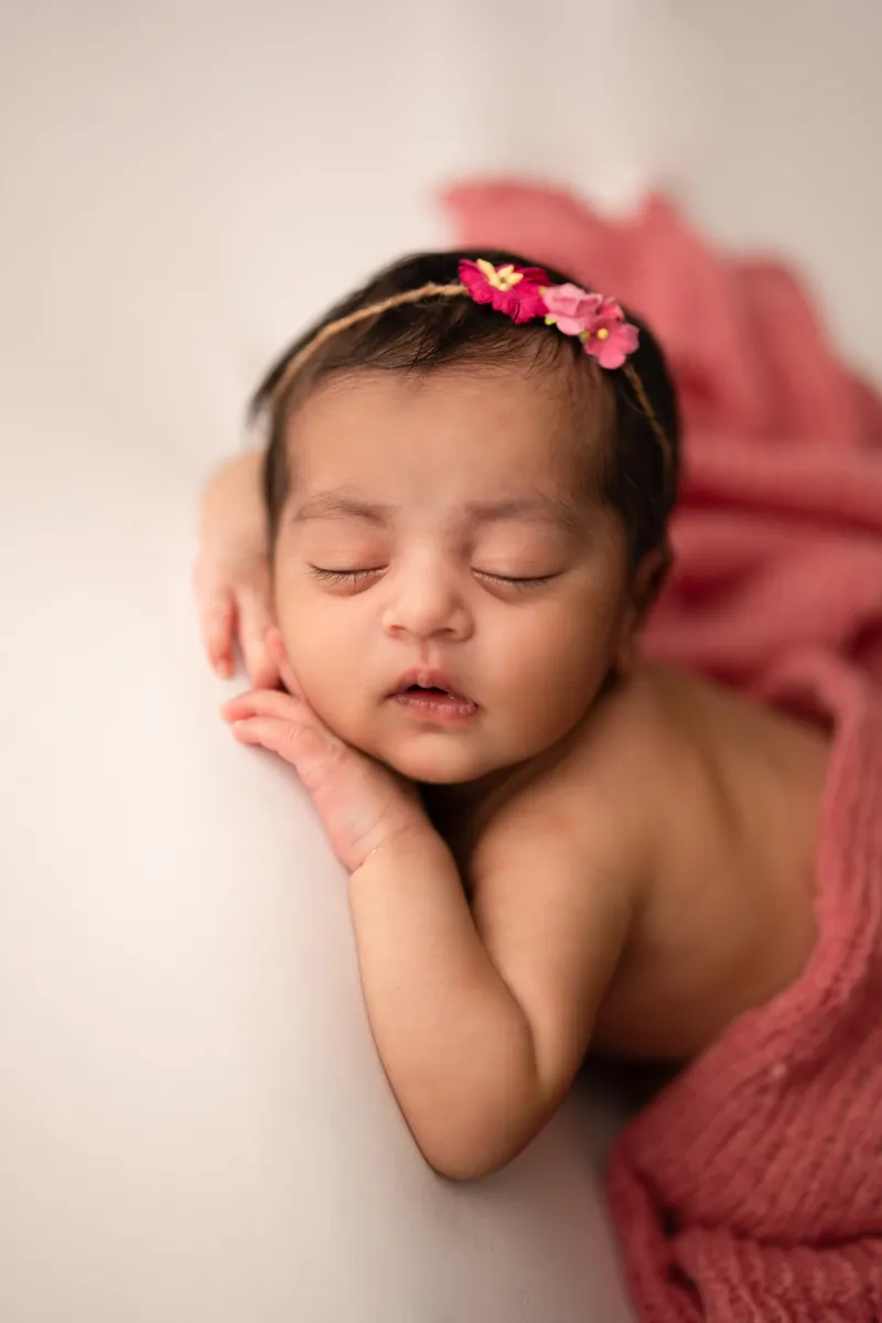 Carefully styled newborn portrait preserving the smallest days · 25
