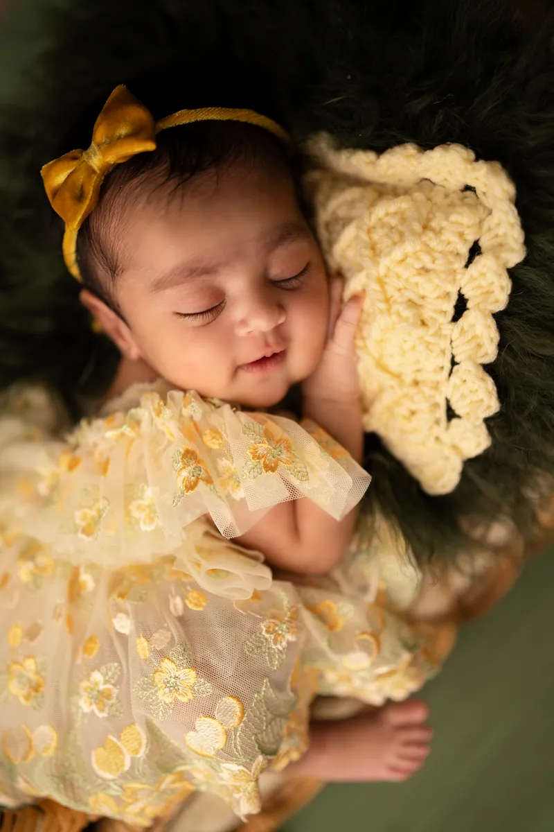 Carefully styled newborn portrait preserving the smallest days · 27