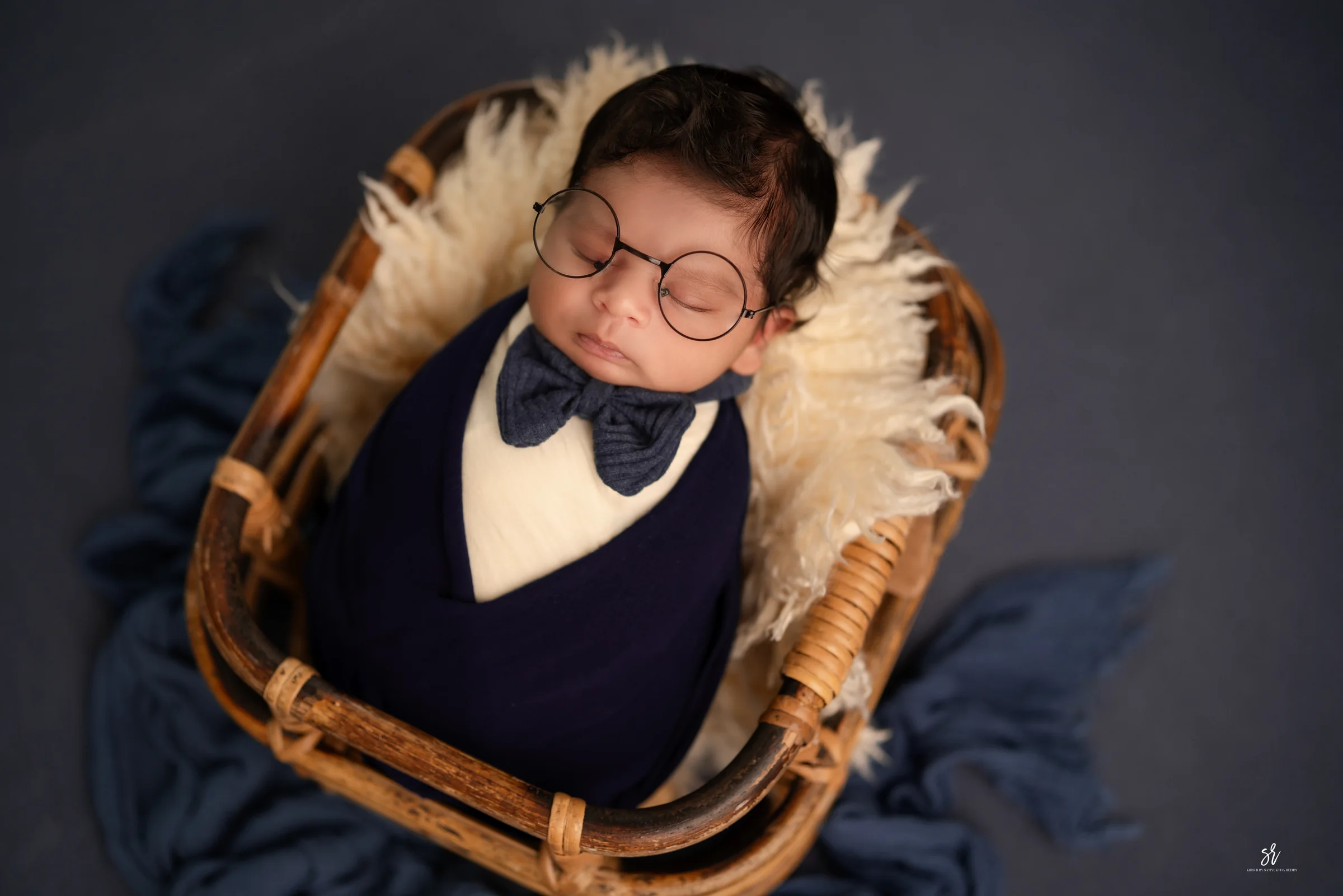 Carefully styled newborn portrait preserving the smallest days · 28