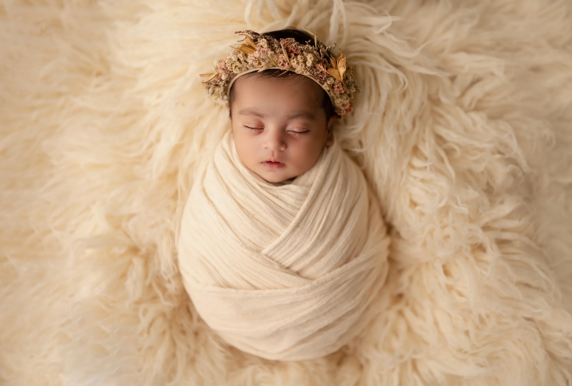 Carefully styled newborn portrait preserving the smallest days · 24