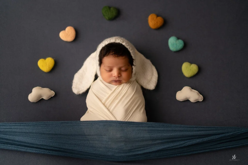 Carefully styled newborn portrait preserving the smallest days · 07